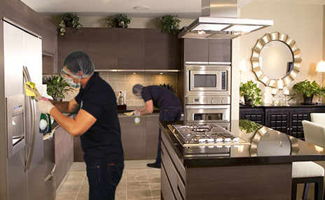 image of kitchen interiors being cleaned by professional cleaners