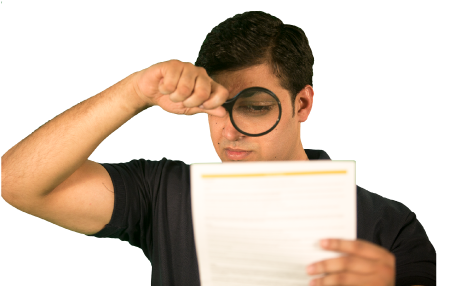 a cleaner looking at a page of print using a magnifying glass