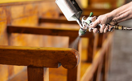 a professional cleaner cleaning an office one is mopping the floor while the other is dusting 